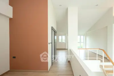 Spacious modern interior with natural light and sleek design, perfect for contemporary living.