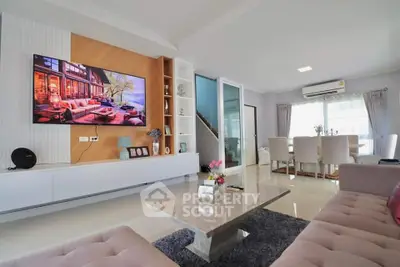 Spacious modern living room with elegant decor and large TV