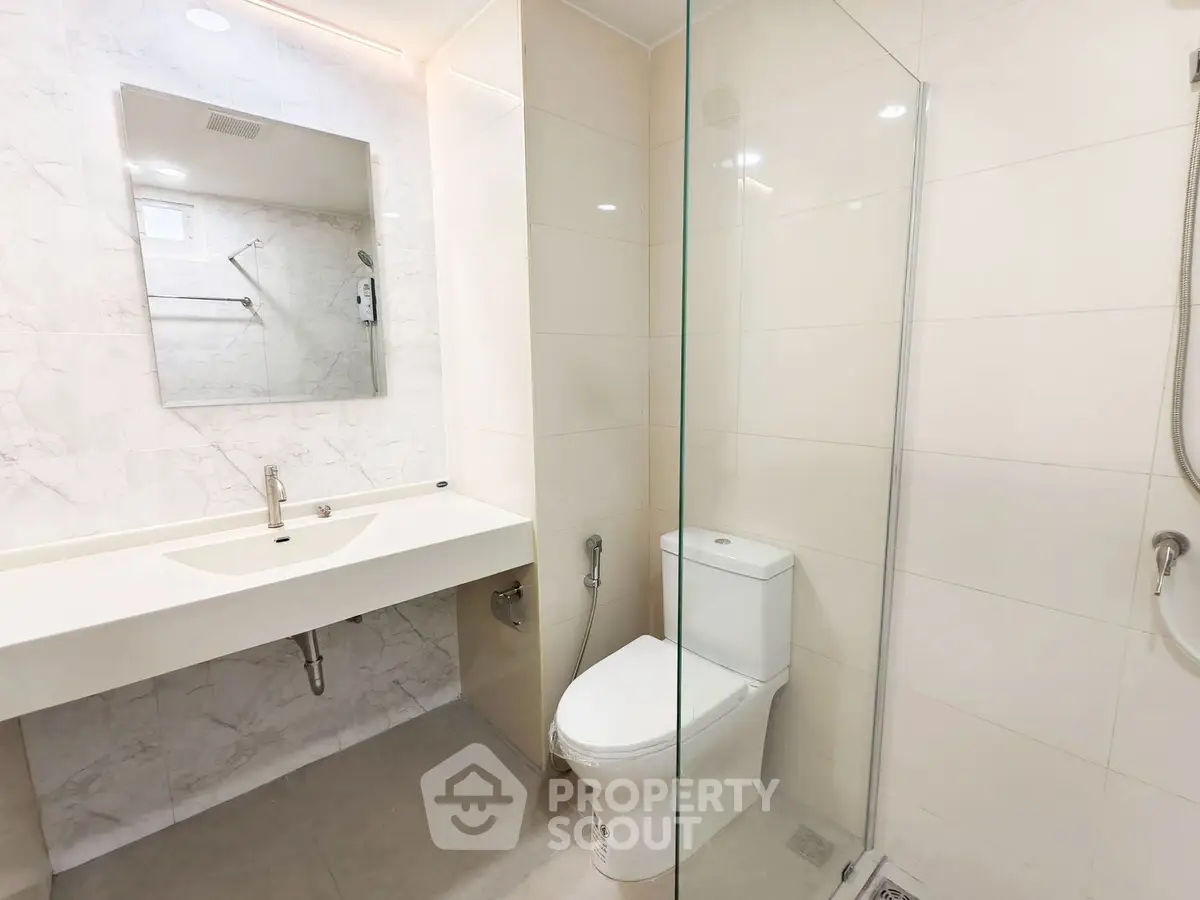 Modern bathroom with sleek design and glass shower enclosure