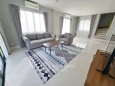 Spacious living room with modern decor and natural light