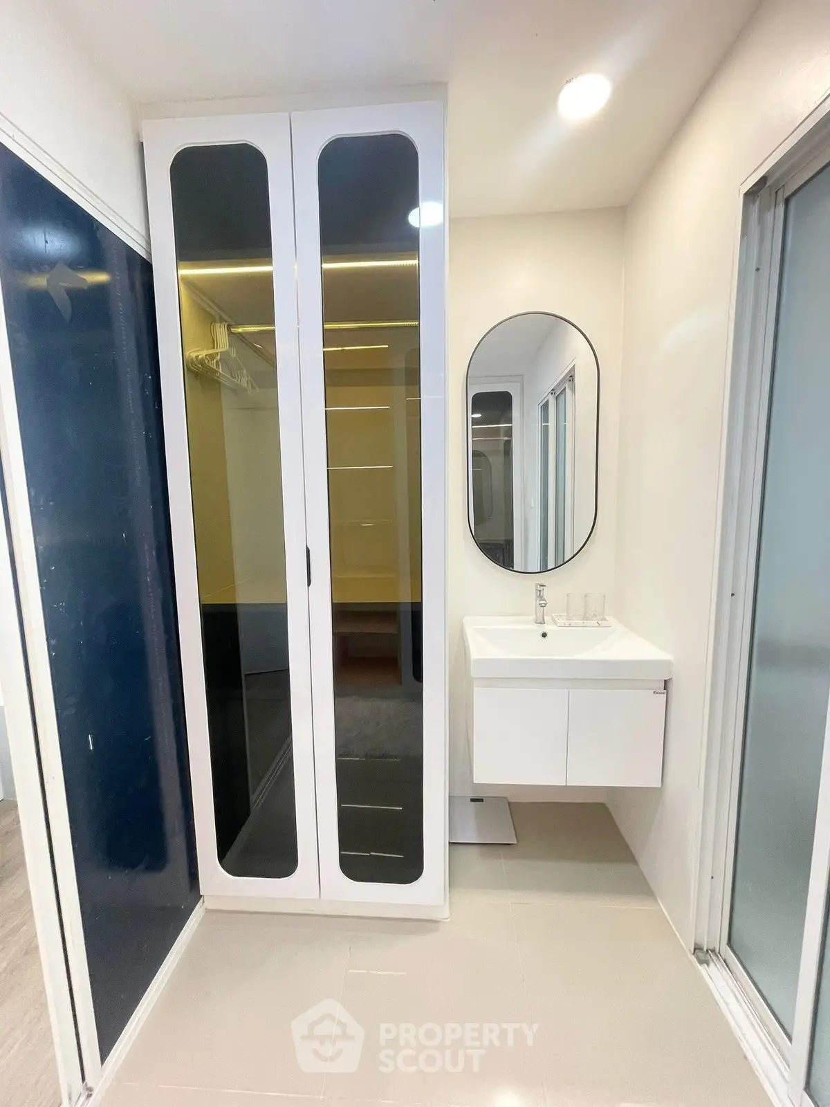 Modern bathroom with sleek storage and elegant sink design