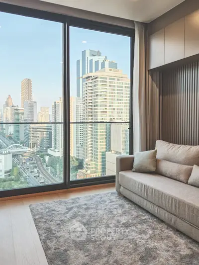 Modern living room with stunning city view through large windows.