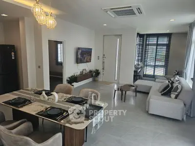 Spacious modern living room with elegant dining area and stylish decor