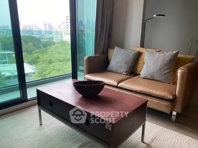 Modern living room with city view, cozy sofa, and stylish coffee table.