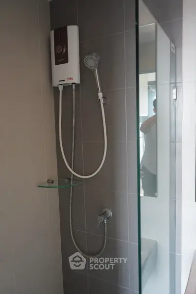Modern bathroom shower with sleek design and water heater