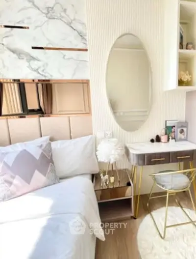 Chic bedroom with elegant decor, featuring a stylish vanity and modern furnishings.