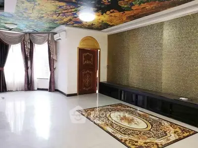 Luxurious living room with ornate ceiling and elegant decor