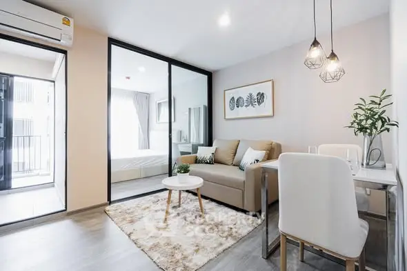 Modern open-plan living room with stylish decor and natural light