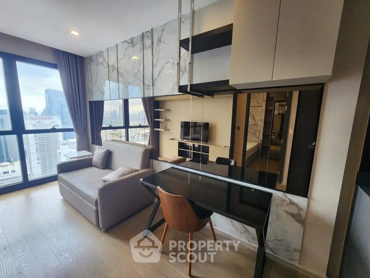 Modern living room with city view, sleek furniture, and stylish decor