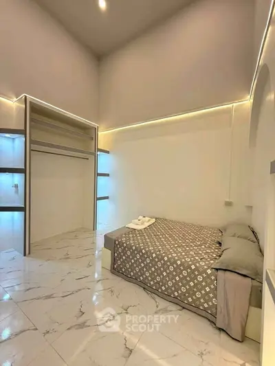Modern minimalist bedroom with high ceiling and marble flooring