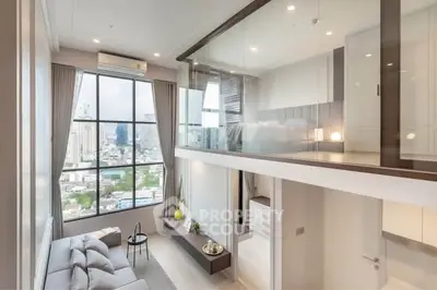 Modern loft apartment with floor-to-ceiling windows and mezzanine bedroom, offering stunning city views.