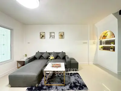 Modern living room with stylish gray sectional sofa and elegant decor