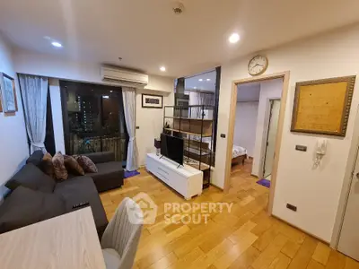 Modern living room with wooden flooring and stylish decor