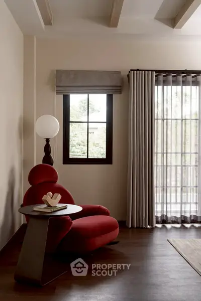 Stylish modern living room with red armchair and elegant decor