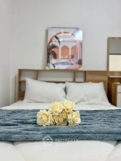 Cozy bedroom with stylish decor and plush bedding, perfect for relaxation.