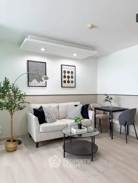 Modern living room with stylish decor and cozy seating area, perfect for relaxation and entertaining.