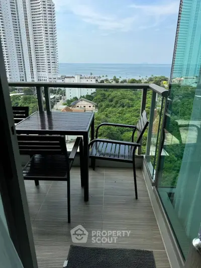 Stunning high-rise balcony with ocean view, perfect for relaxation and enjoying the scenery.