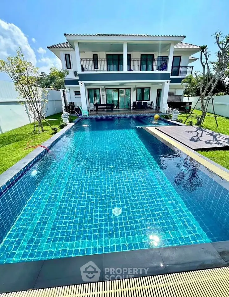 Luxurious villa with stunning pool and spacious garden, perfect for relaxation and entertainment.