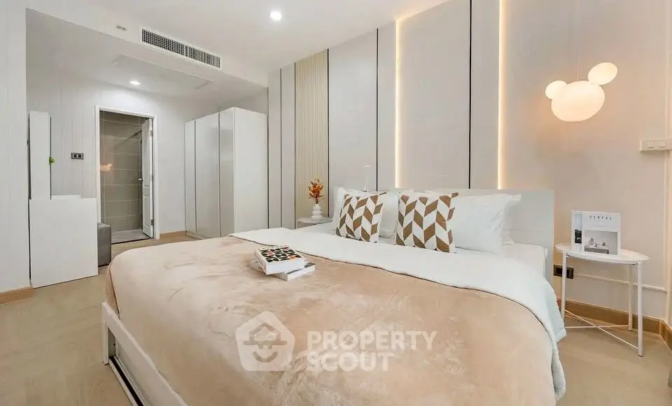 Luxurious modern bedroom with elegant decor and ambient lighting