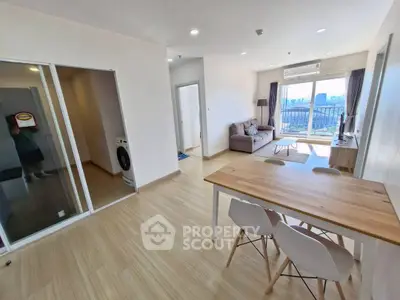 Spacious modern living room with open layout and balcony view