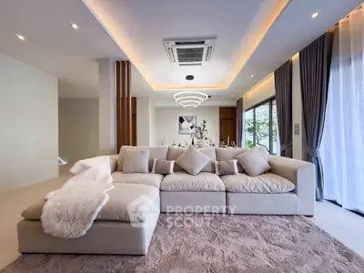 Luxurious modern living room with plush sofa and elegant lighting