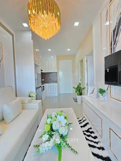 Luxurious modern living room with elegant chandelier and stylish decor