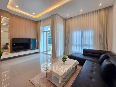 Spacious modern living room with elegant lighting and large windows