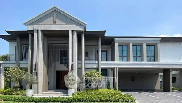 Luxurious modern house exterior with grand entrance and spacious driveway