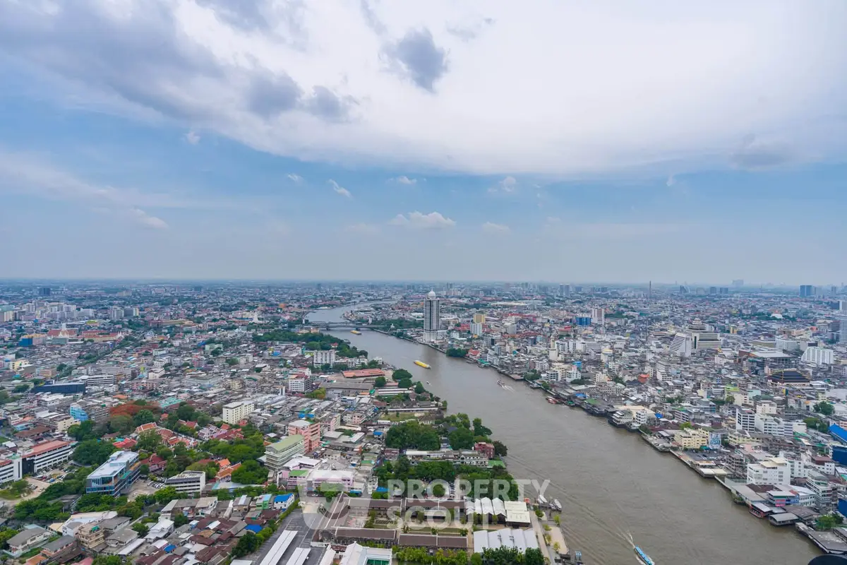 Stunning panoramic cityscape view with river, showcasing urban skyline and vibrant city life.