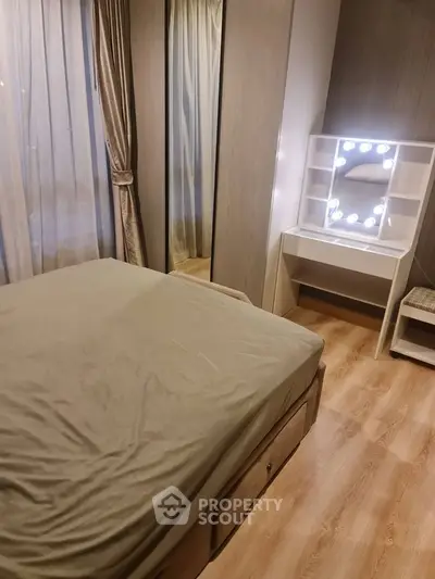 Cozy bedroom with elegant vanity and ample natural light