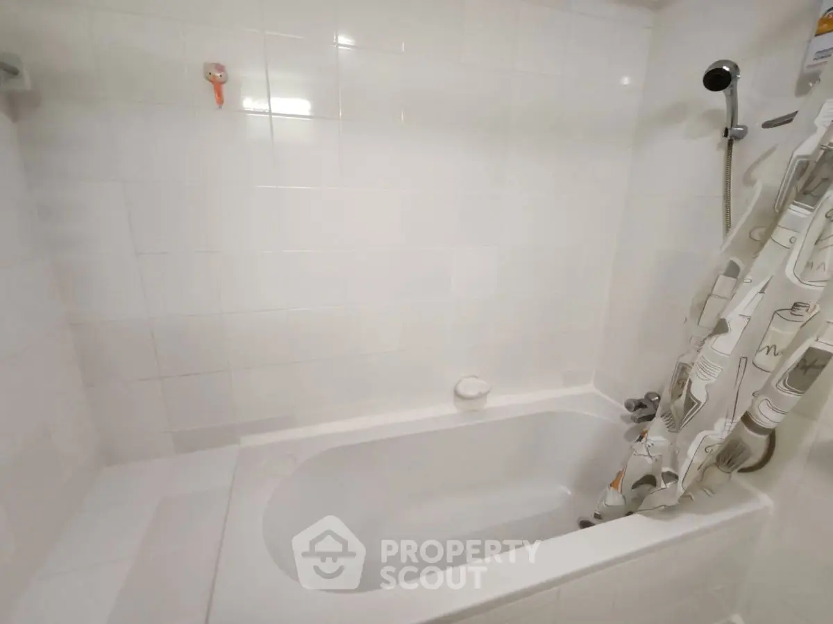 Cozy bathroom with bathtub and modern shower curtain