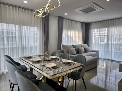 Elegant modern living room with stylish dining area and luxurious sofa