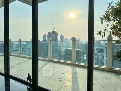 Luxurious high-rise balcony with stunning city skyline view at sunset