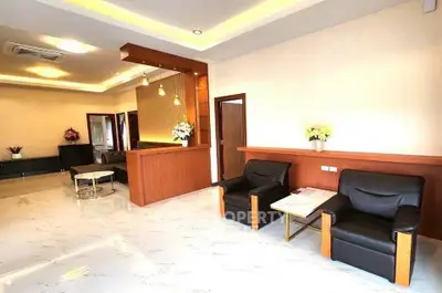Spacious modern living room with elegant lighting and stylish furniture