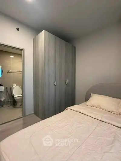 Cozy bedroom with ensuite bathroom and modern wardrobe