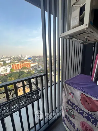High-rise balcony with city view and decorative cover