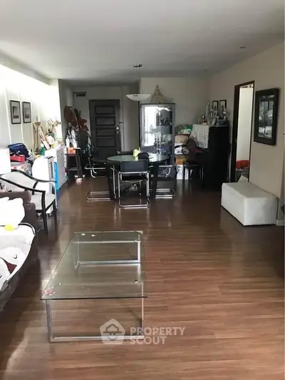 Spacious living room with modern furniture and wooden flooring