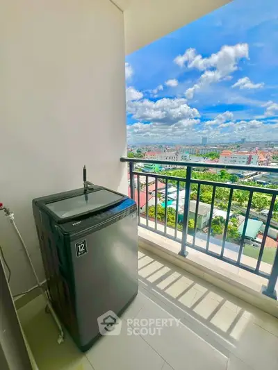 High-rise balcony with washing machine and stunning city view