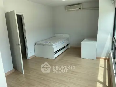 Spacious bedroom with minimalist design and natural light