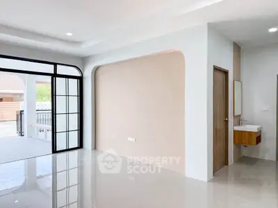 Spacious modern living area with sleek design and large windows