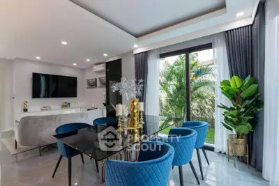 Luxurious modern living room with elegant dining area and garden view