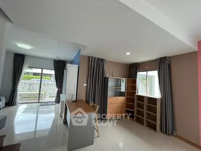 Spacious modern living room with sleek furniture and large windows