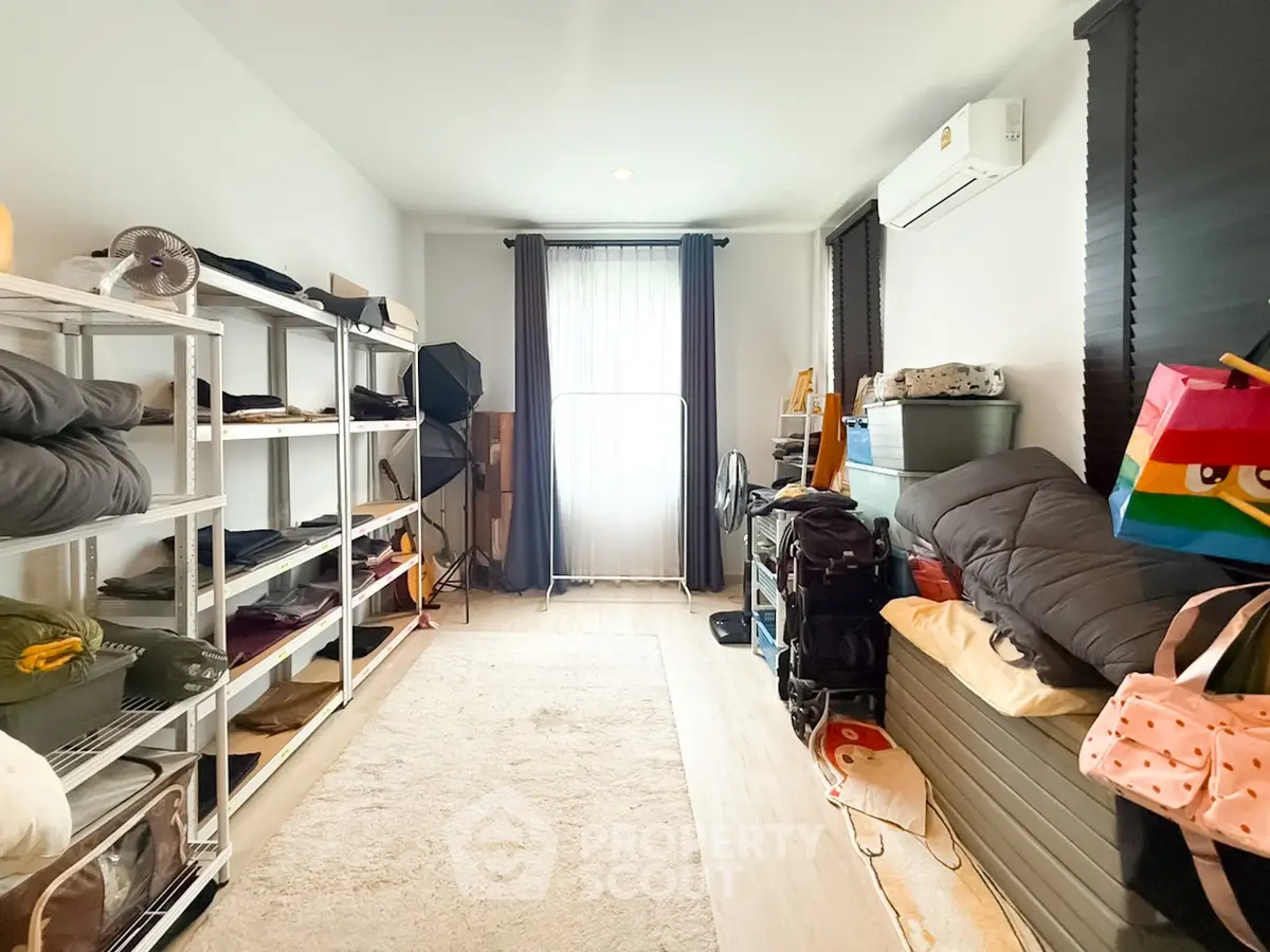Spacious storage room with organized shelves and natural light, perfect for efficient home organization.