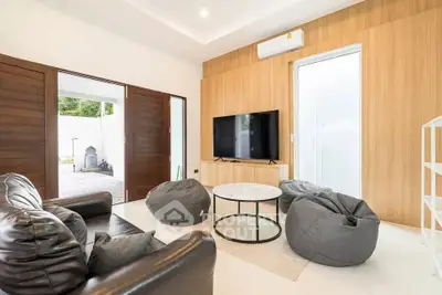 Modern living room with stylish furniture and outdoor access
