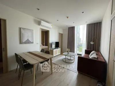 Modern living room with stylish furniture and city view, perfect for urban living.
