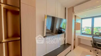 Modern living room with wall-mounted TV and large window view