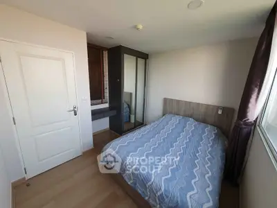 Cozy bedroom with modern decor and ample natural light