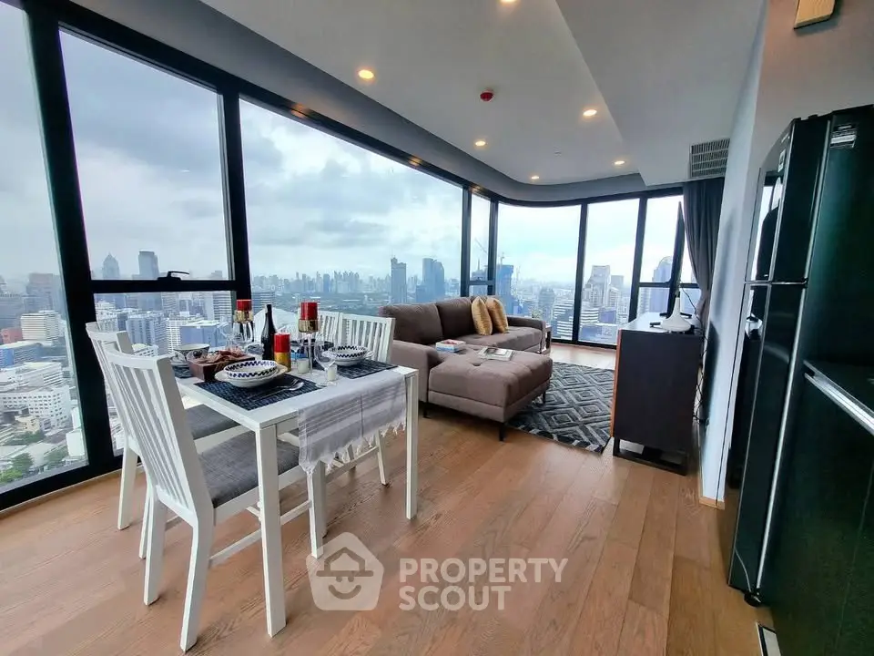Stunning corner unit with panoramic city views, spacious living area, and modern furnishings.