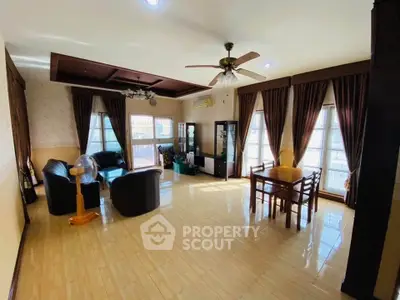 Spacious living room with elegant decor and ample natural light