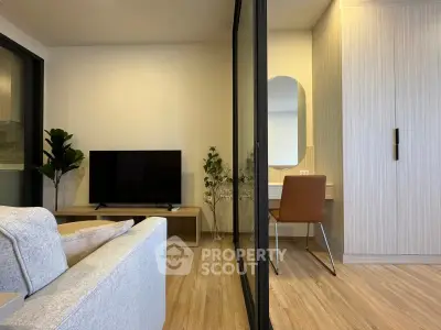 Modern living room with stylish decor and a cozy workspace